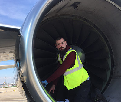 Testia Inspector conducting penetrant testing in an aircraft engine at Orly Airport